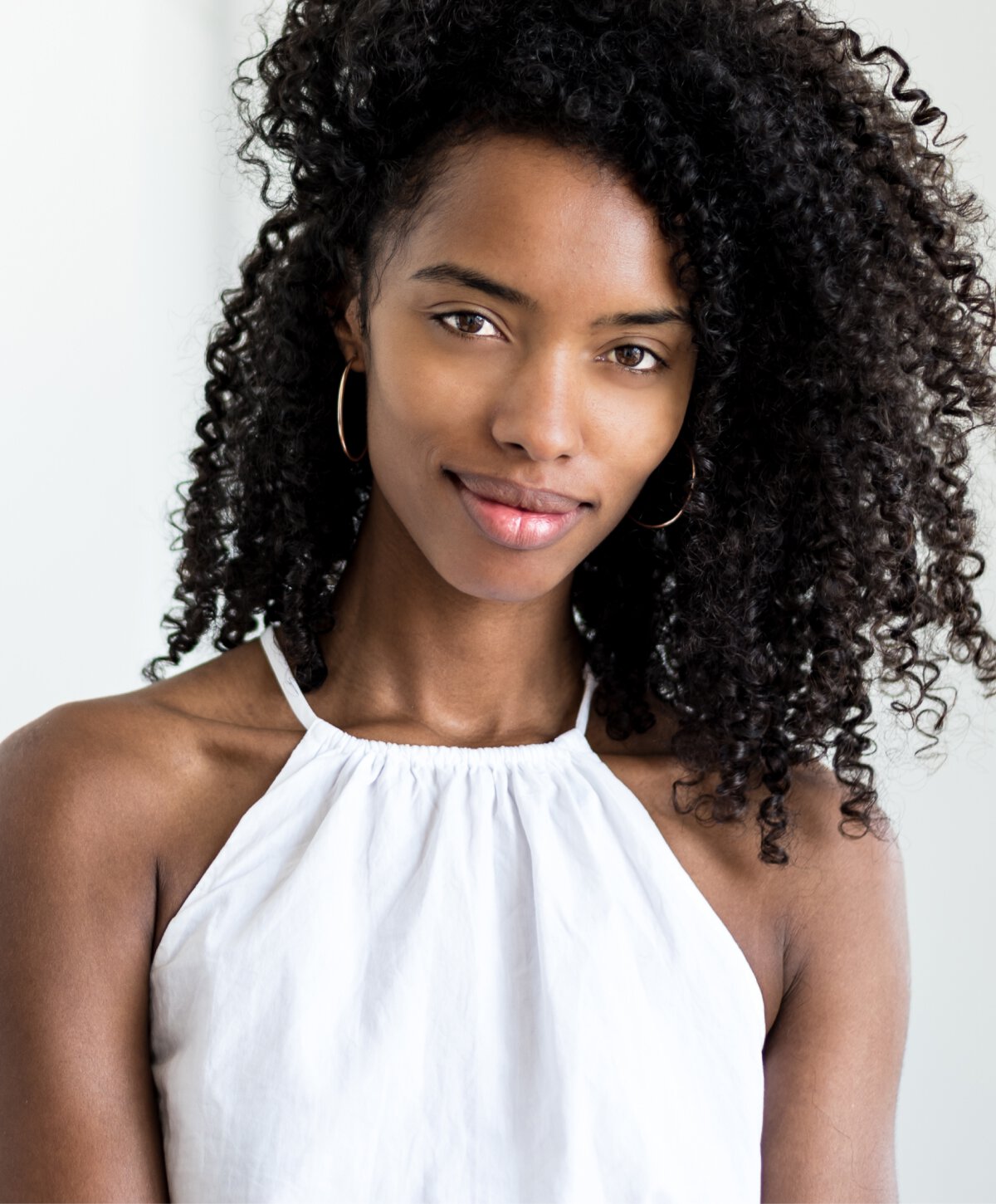Northern VA skin treatment model with curly hair